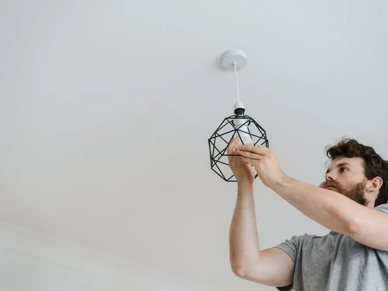 Installing a pendant light fixture on a white ceiling